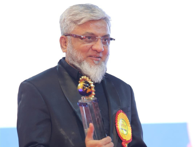 KP Group executive holding the Lamhe Award trophy presented by the Rotary Club